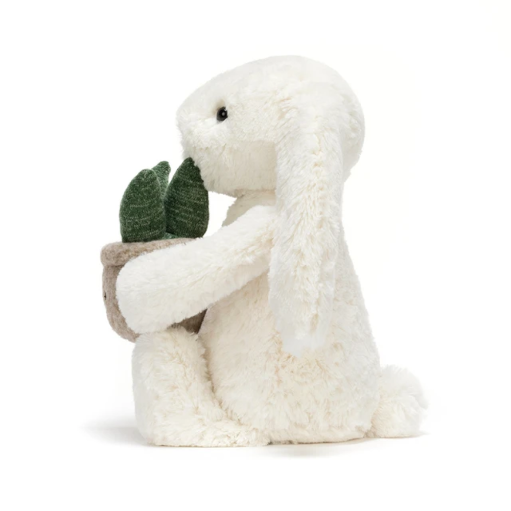 Peluche lapin crème tenant une plante – vue 3